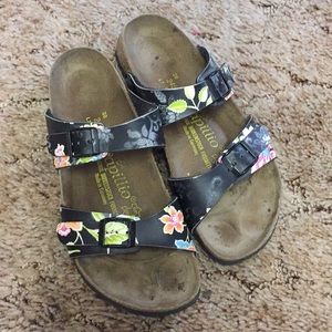 Papillon by Birkenstock black flowered slip ons.